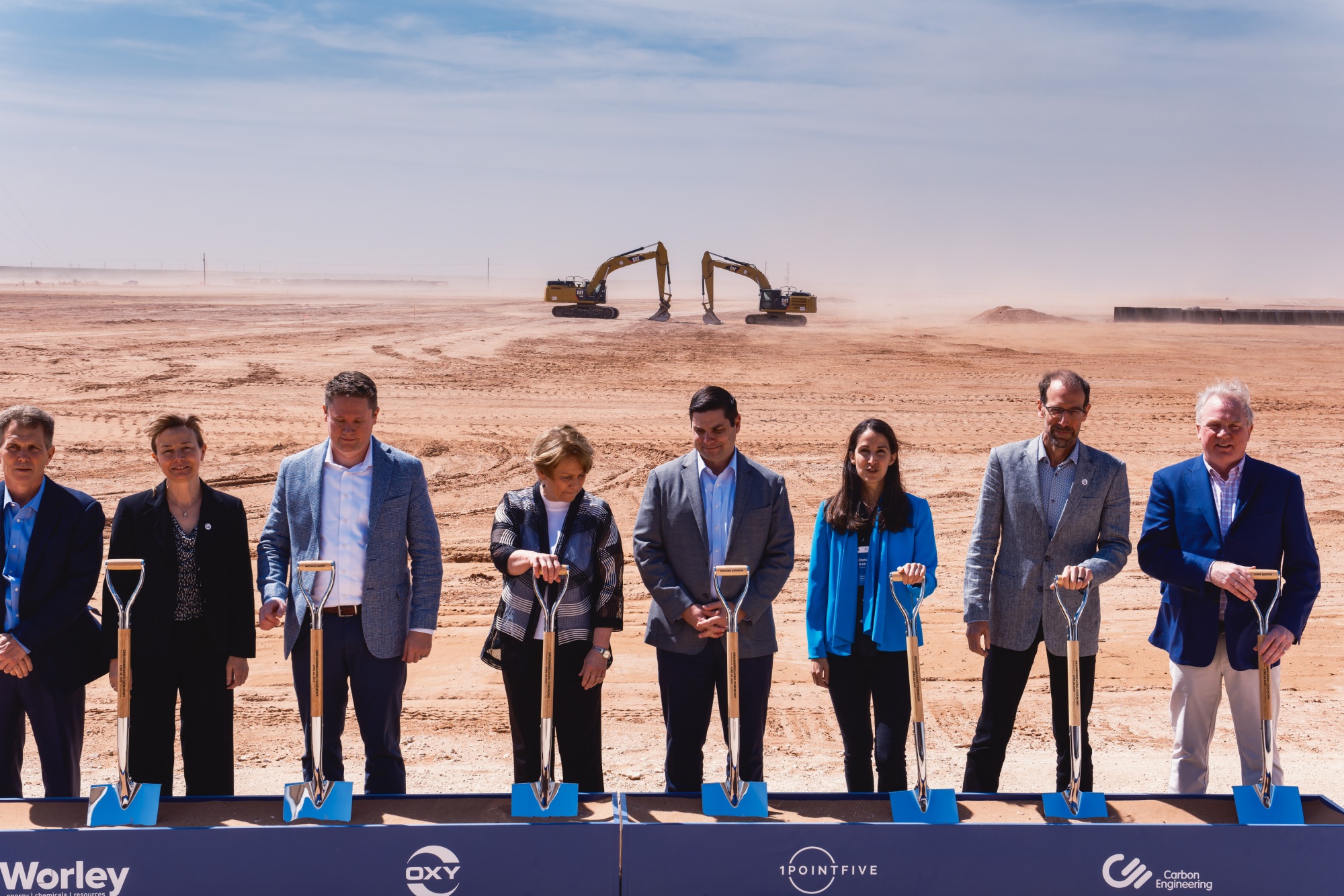 Executives hold shovels during a groundbreaking ceremony for the first large direct-air capture plant&nbsp;to be built in Texas, US by Occidental Petroleum and Carbon Engineering.