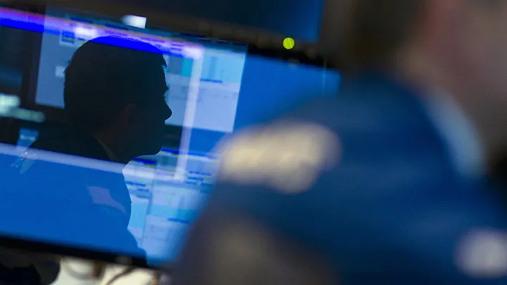 A trader is reflected in a monitor as he works on the floor of the New York Stock Exchange (NYSE) in New York, U.S., on Tuesday, May 28, 2013. U.S. stocks rose, with the Standard &amp; Poor’s 500 Index rebounding from a weekly loss, after data showed consumer confidence climbed to the highest level since 2008 and home values jumped the most in seven years. 
