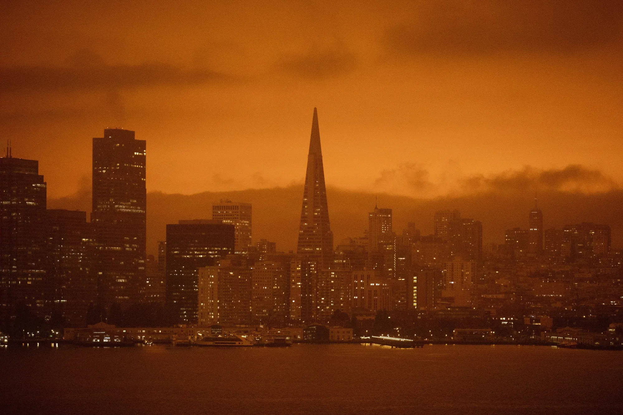 Dark orange skies caused by wildfire smoke hang over San Francisco in September 2020.