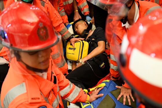 Hong Kong Airport Beatings Show Protesters’ Fears Running Wild