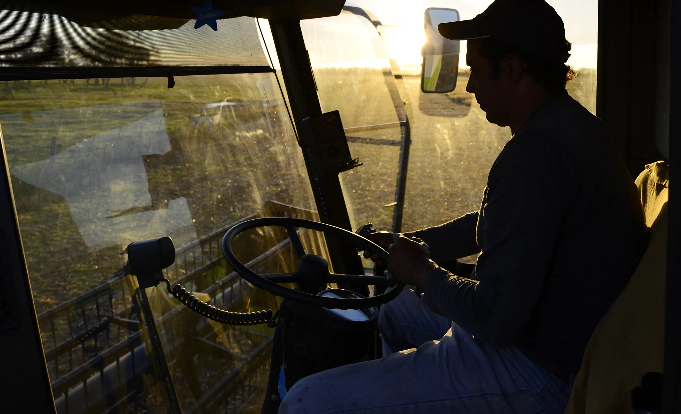 A farmer drives his tractor during the soybean harvest at a farm near Salto, in the north of Buenos Aires province, Argentina.

