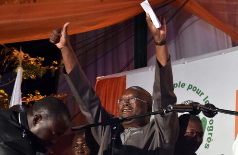 Roch Marc Christian Kabore waves to supporters