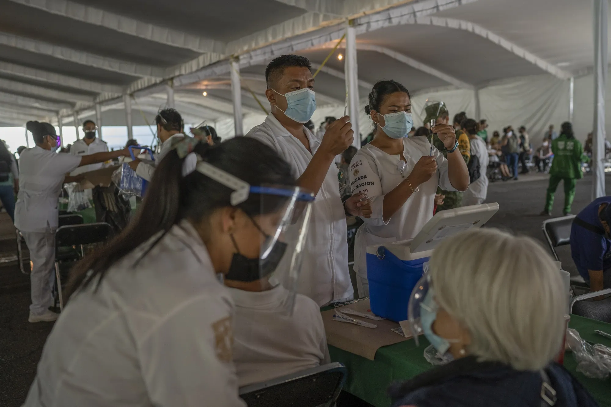 Healthcare workers prepare doses of the Sinovac Covid-19 vaccine in Mexico City on April 19, 2021. 