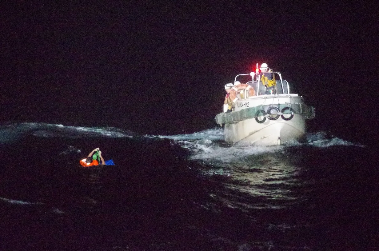A worker of the capsized ship 'The Gulf Livestock 1' is seen being rescued by Japan Coast Guard in the East China Sea off the coast of Amami Oshima, Japan on Sept.&nbsp;2.&nbsp;