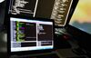 A man types code on a laptop.