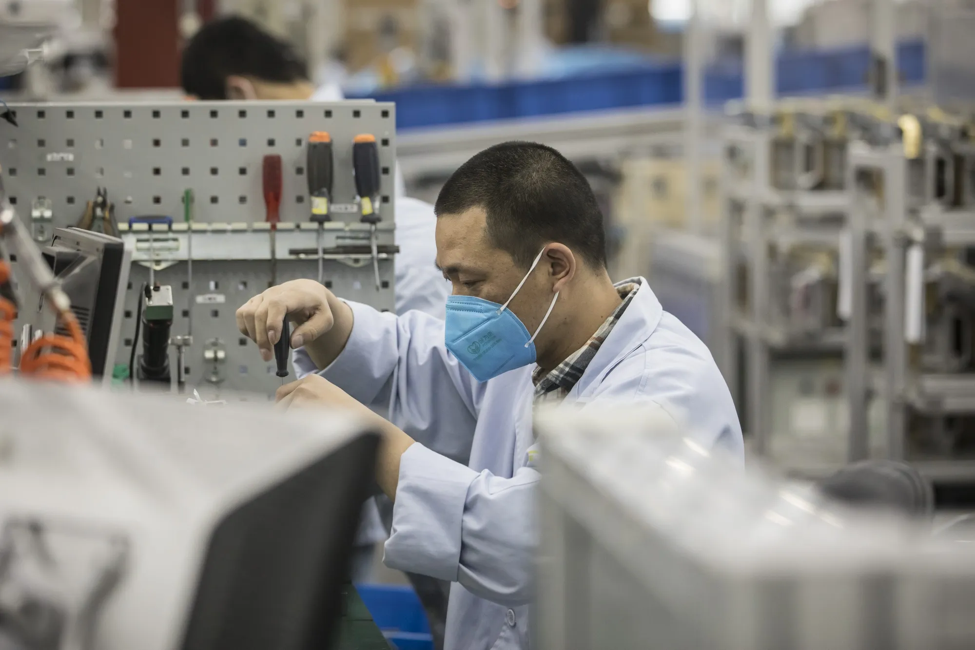 An employee works on a production line in Shanghai.