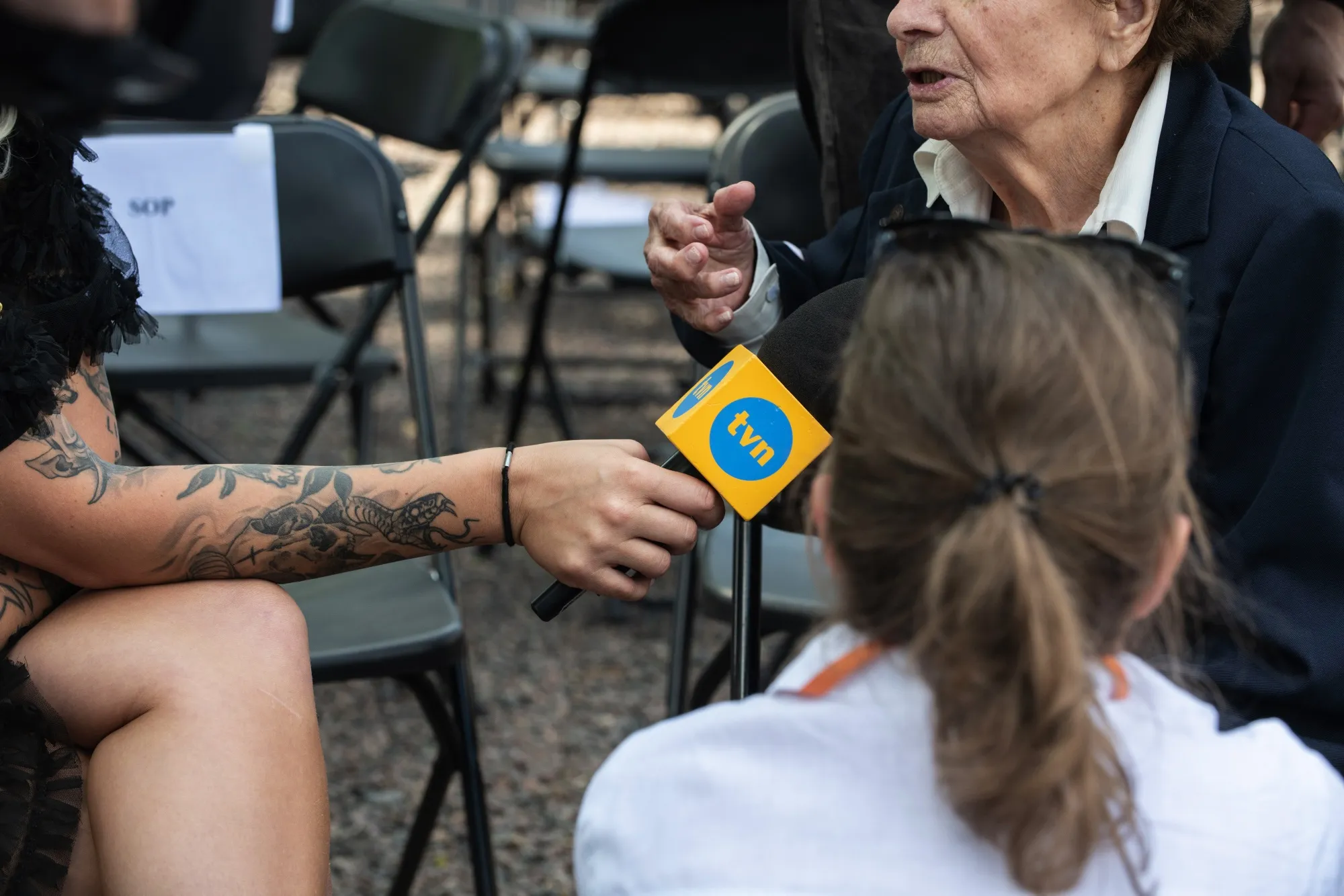 A TVN24 news reporter conducts interviews in Warsaw.