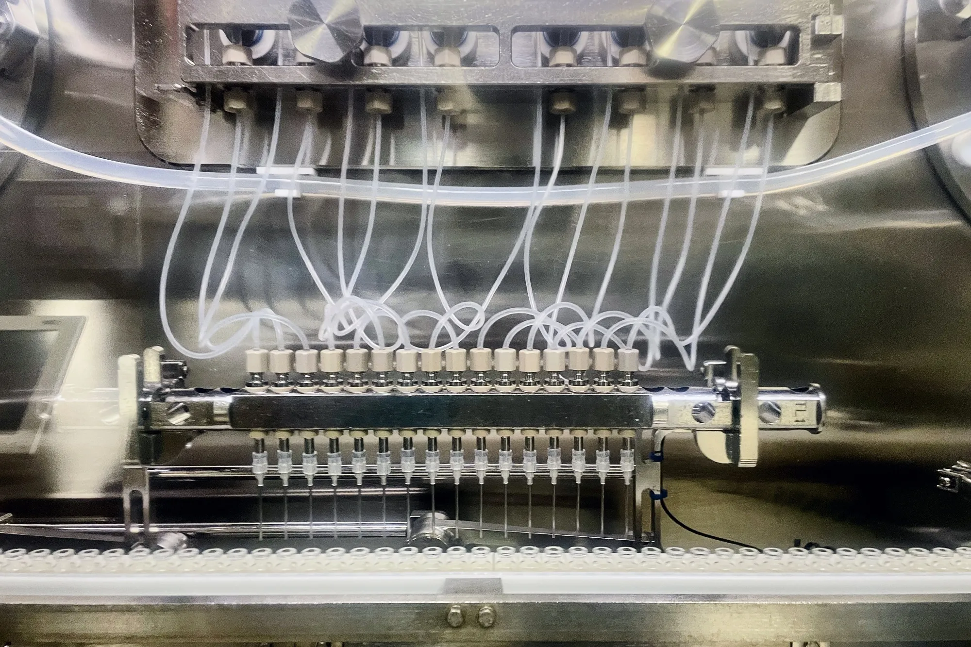 RSV vaccine&nbsp;is poured&nbsp;into glass vials at a&nbsp;research and development center in Wavre, Belgium.