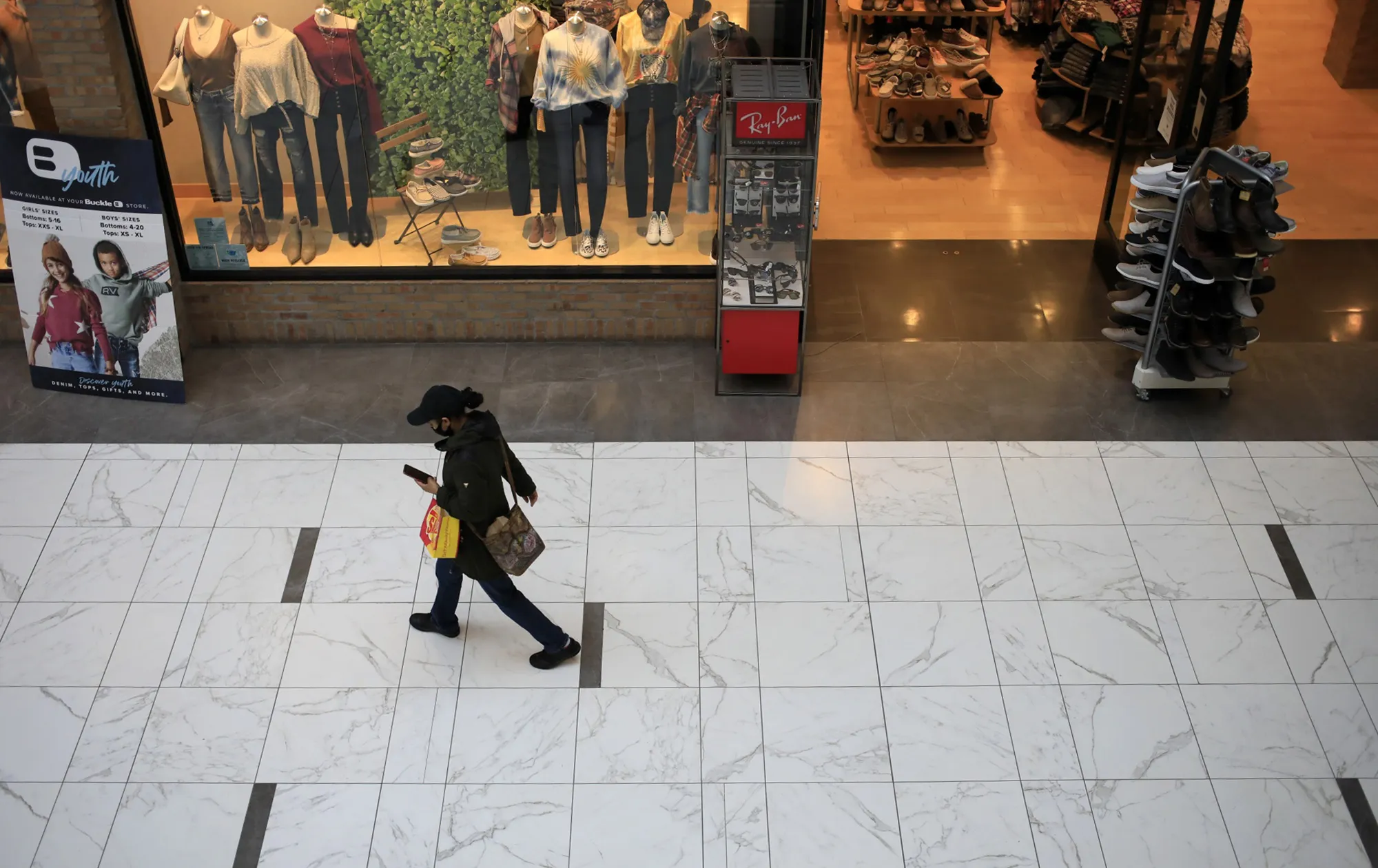 A shopper walks through a mall in Columbus, Ohio.