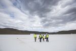 Employees and a member of the media walk on the roof of the Tesla Motors Inc. Gigafactory in McCarran, Nevada, U.S..