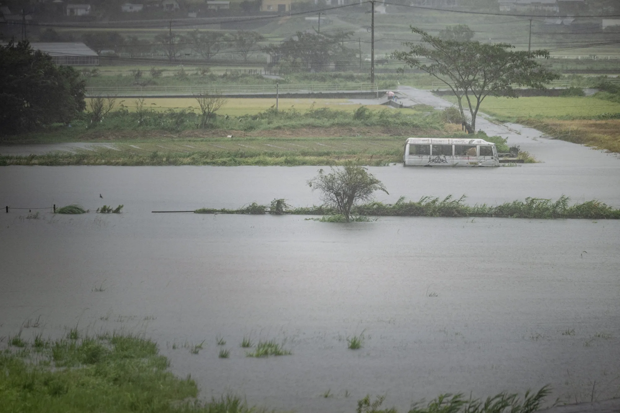 A bus submerged in floodwaters in Yufu city of Oita prefecture on Aug. 29.