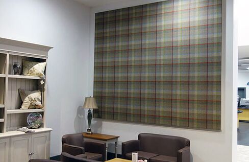Acoustic panels turned into art can help dampen the roar in noisy restaurants.