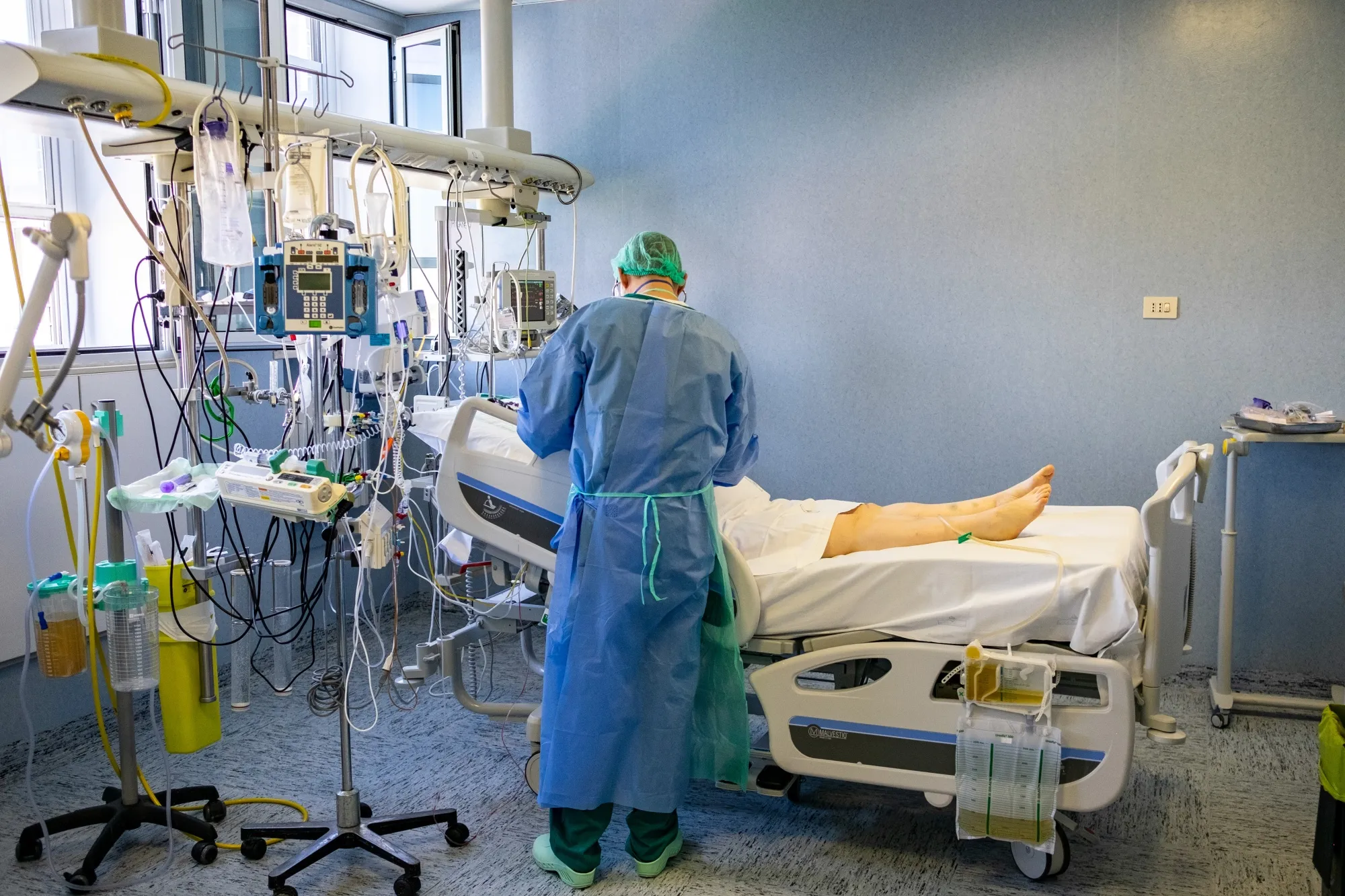 A medical worker checks on&nbsp;a patient, who has tested positive for Covid-19, in the intensive care unit of a hospital in Cremona, Italy on April 9.