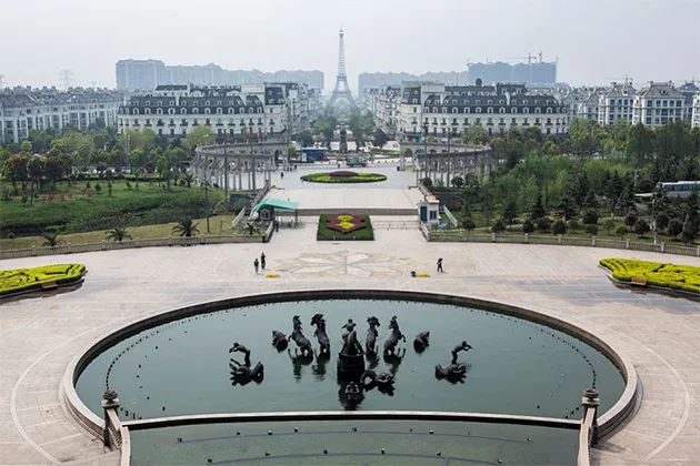 Pictured, on the outskirts of Hangzhou, copies of Parisian townhouses, complete with Eiffel Tower.