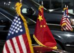 US and Chinese national flags are seen o