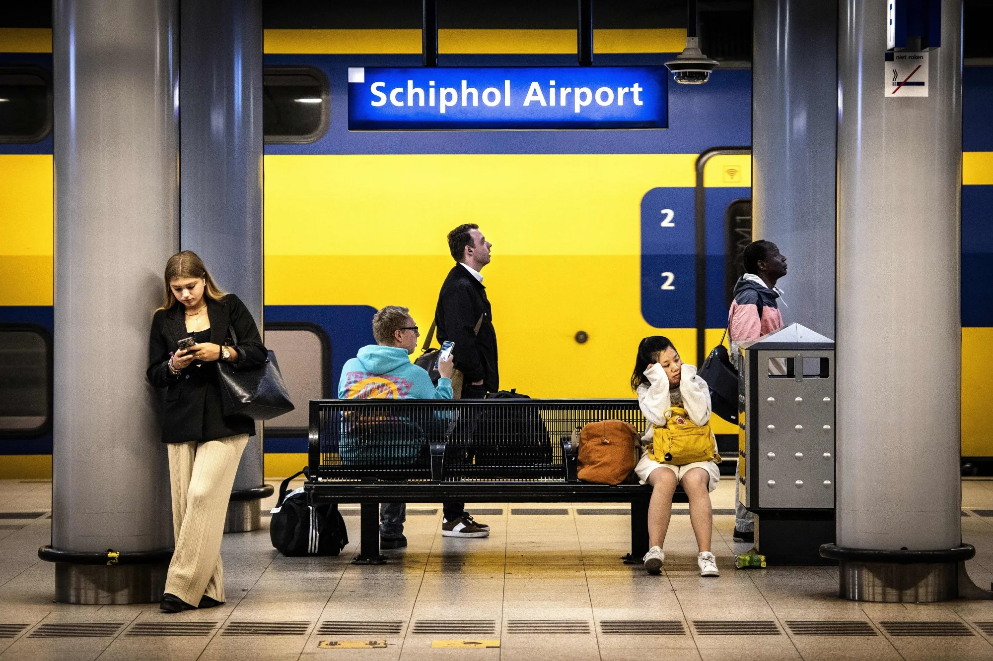 Travellers&nbsp;at the Schiphol Airport train station in Amsterdam.&nbsp;