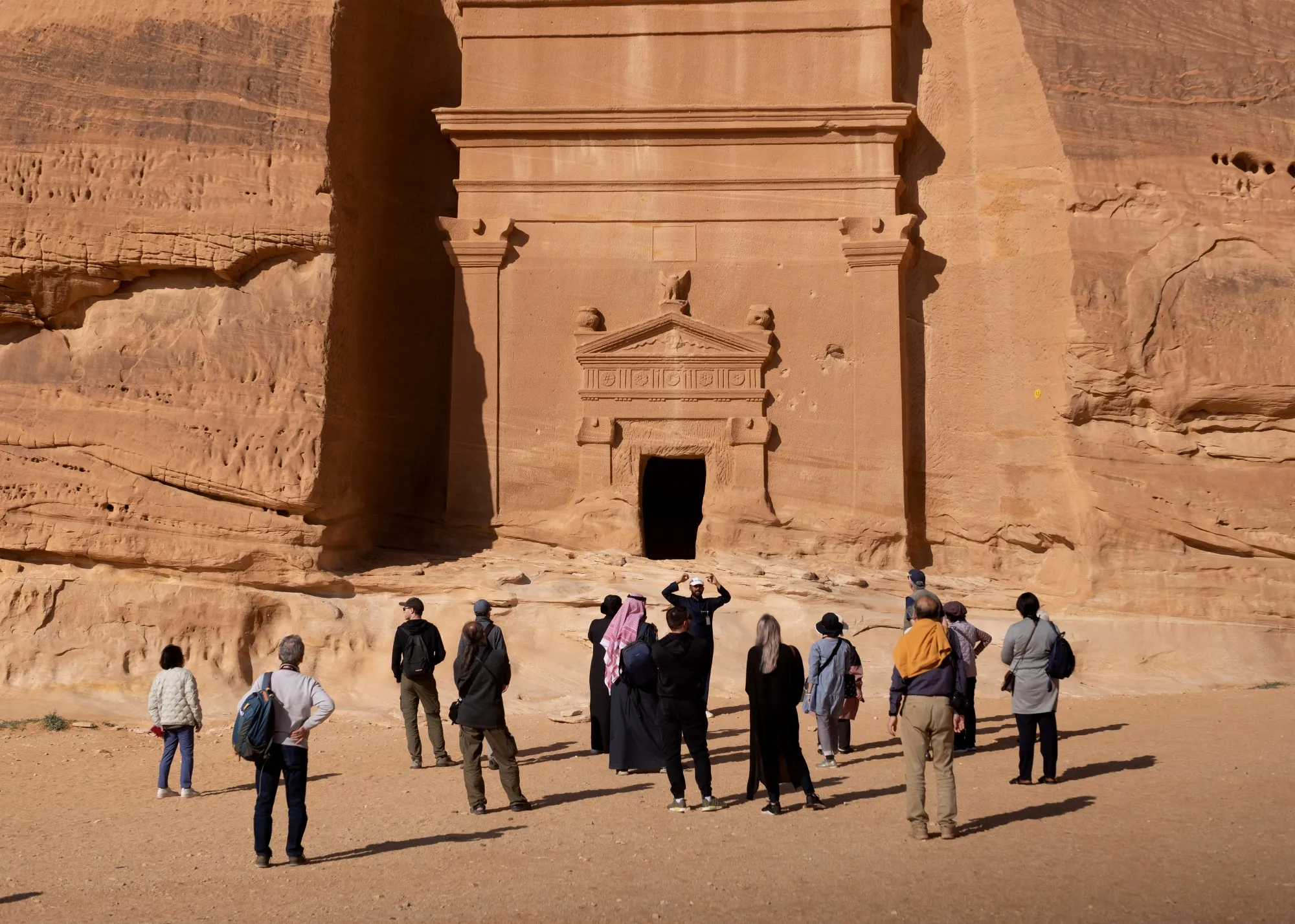 Tourists at the ancient Nabataean site of Hegra in AlUla, Saudi Arabia.