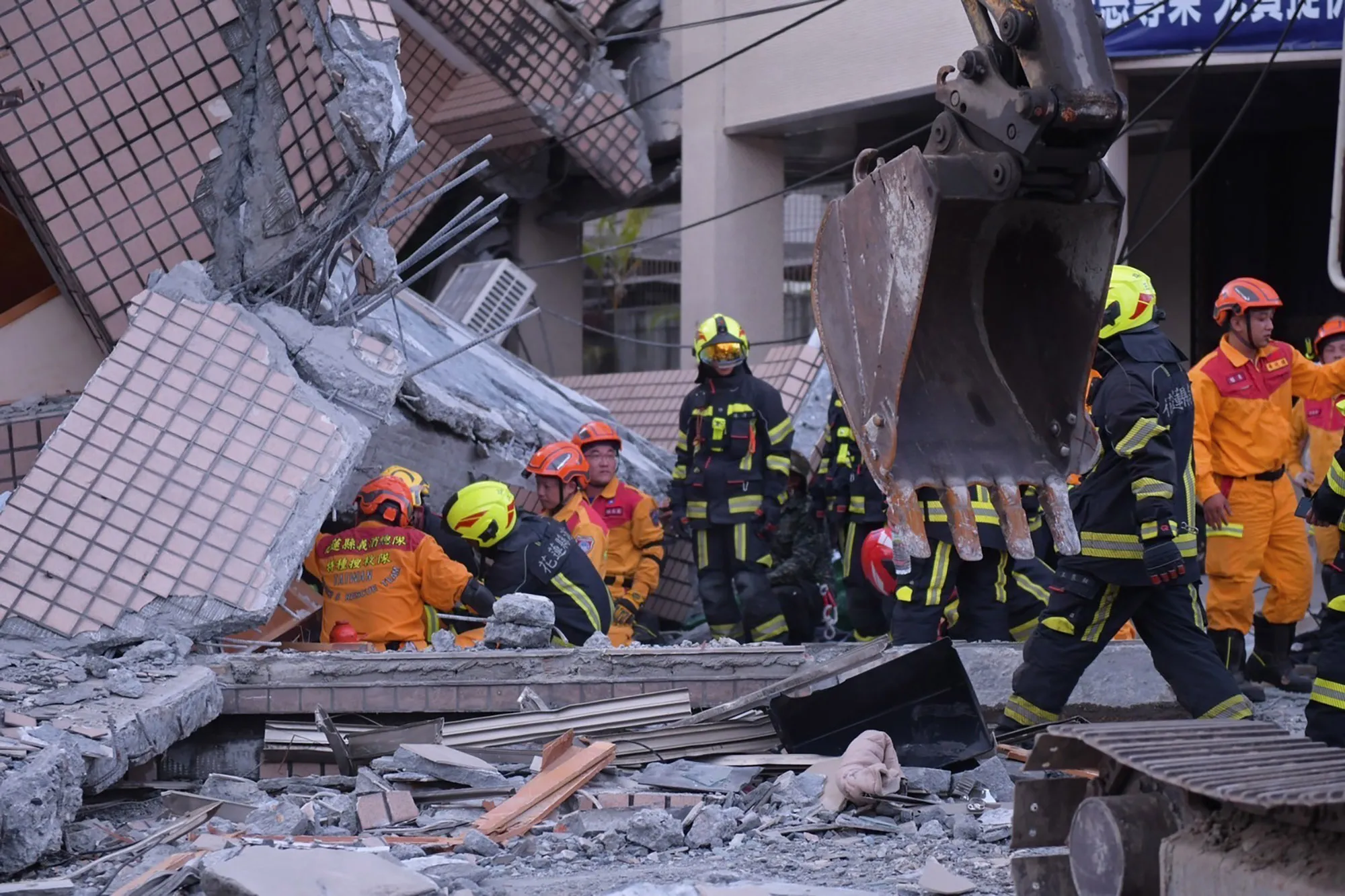 Firefighters&nbsp;at a collapsed building during a rescue operation following an earthquake in Yuli township, Taiwan, Sept. 18.