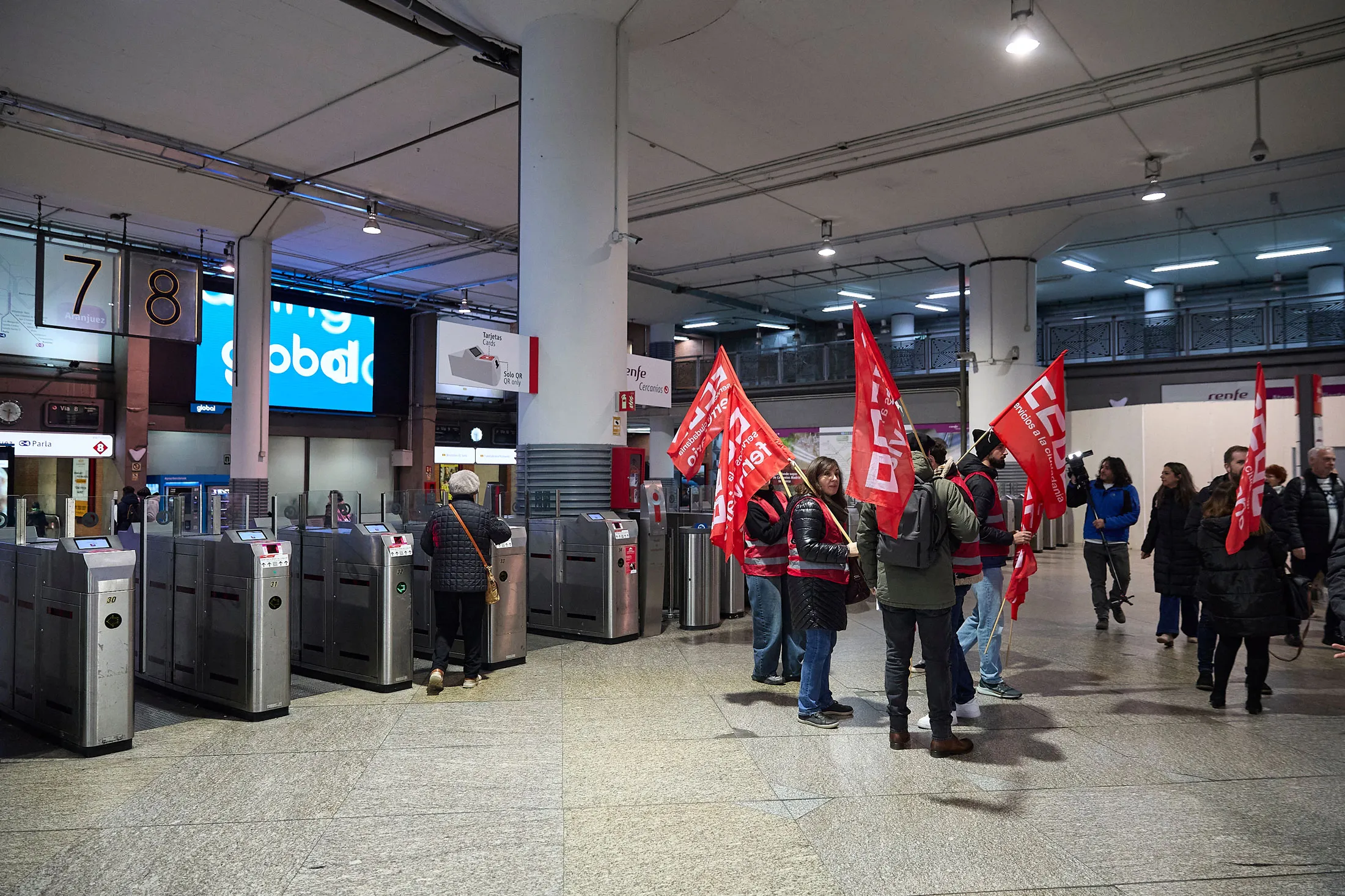 Strikers carrying union flags at Madrid-Puerta de Atocha-Almudena Grandes train station, on Feb. 9.