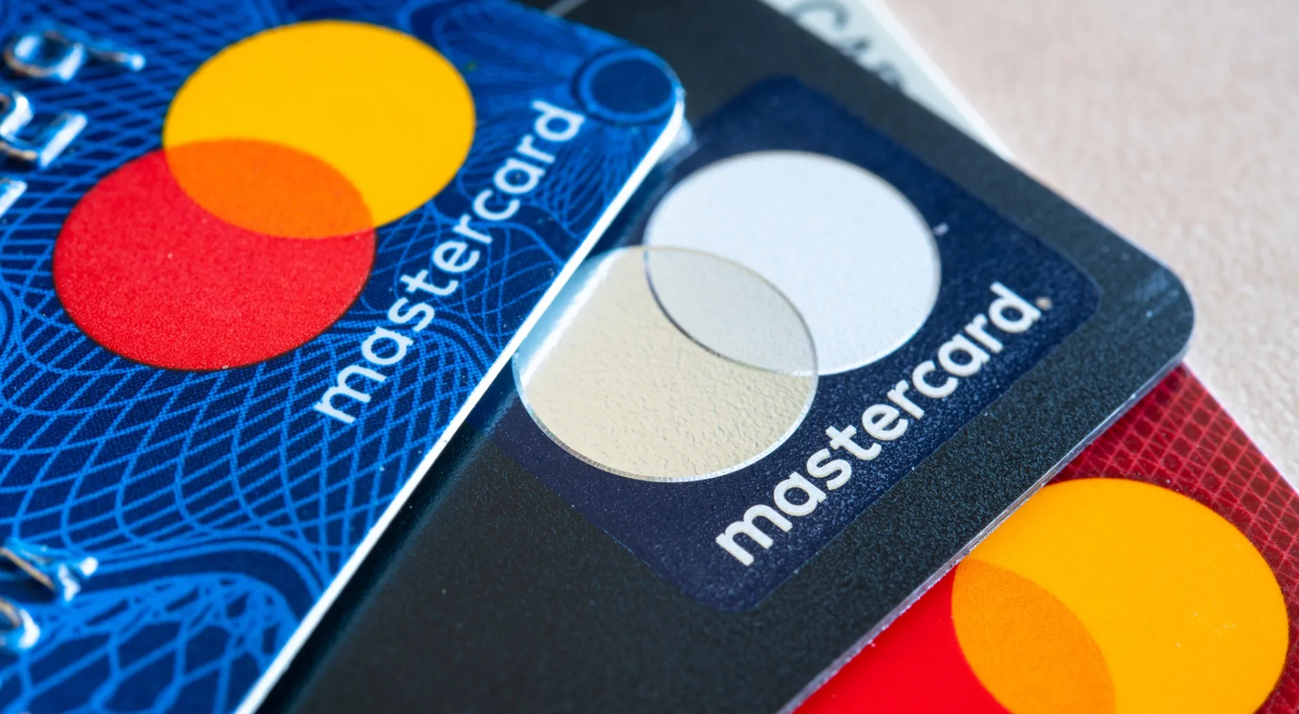 In this photo illustration there are three Mastercard Credit