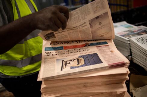 Bundles Of The Financial Times Newspaper Arrive At A Distribution Centre And Are Delivered Around London