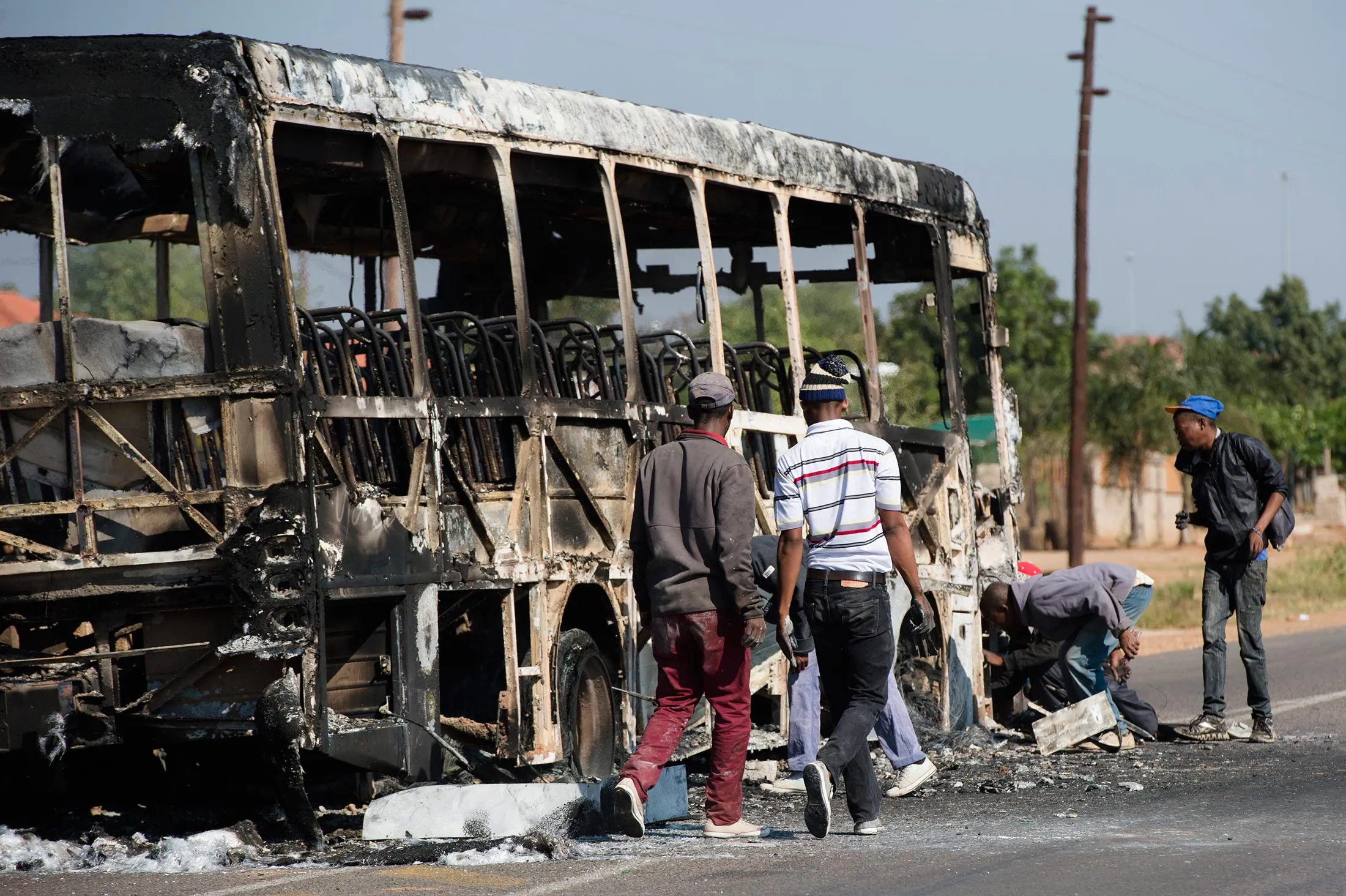 Protesters burn properties and barricade the roads during protest against eviction on May 23, 2016 in Hammanskraal, South Africa.
