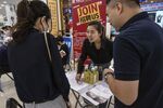 BEIJING, CHINA - JUNE 9: A recruiter, centre, speaks to a woman seeking employment at a job fair on June 9, 2023 in Beijing, China. While China’s overall jobless rate is down, youth unemployment in the country is hovering near a record high of 20.4% as the world’s second largest economy slowly emerges from tough zero COVID restrictions. The problem is expected to worsen in the coming months with more than a million college graduates expected to enter the job market. (Photo by Kevin Frayer/Getty Images)