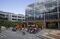 People eat lunch in a courtyard outside of the Amazon offices.