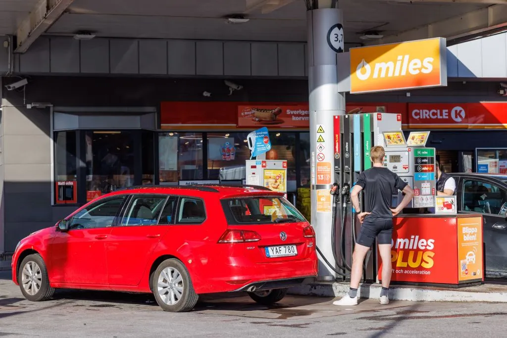 A man fuels a vehicle at a gas station in the Stockholm area.