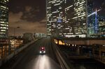 Skyscrapers illuminated at night in La Defense business district in Paris