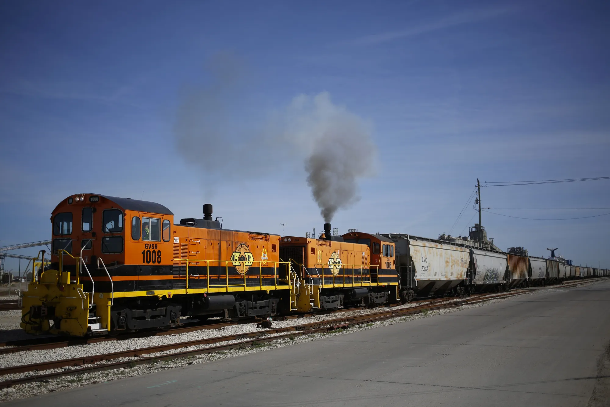 Genesee &amp; Wyoming Inc. switching locomotives pull a grain train at the Port of Galveston in Galveston, Texas.
