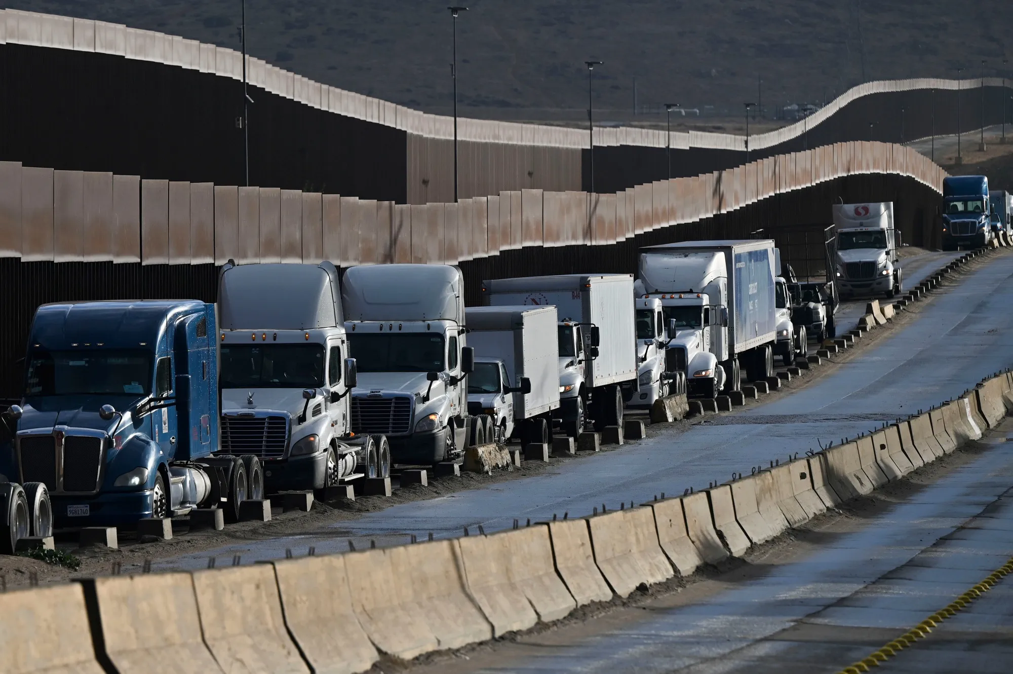 Tractor trailers wait in line at the Otay Mesa Port of Entry, on the US-Mexico border in Tijuana, Baja California, Mexico.