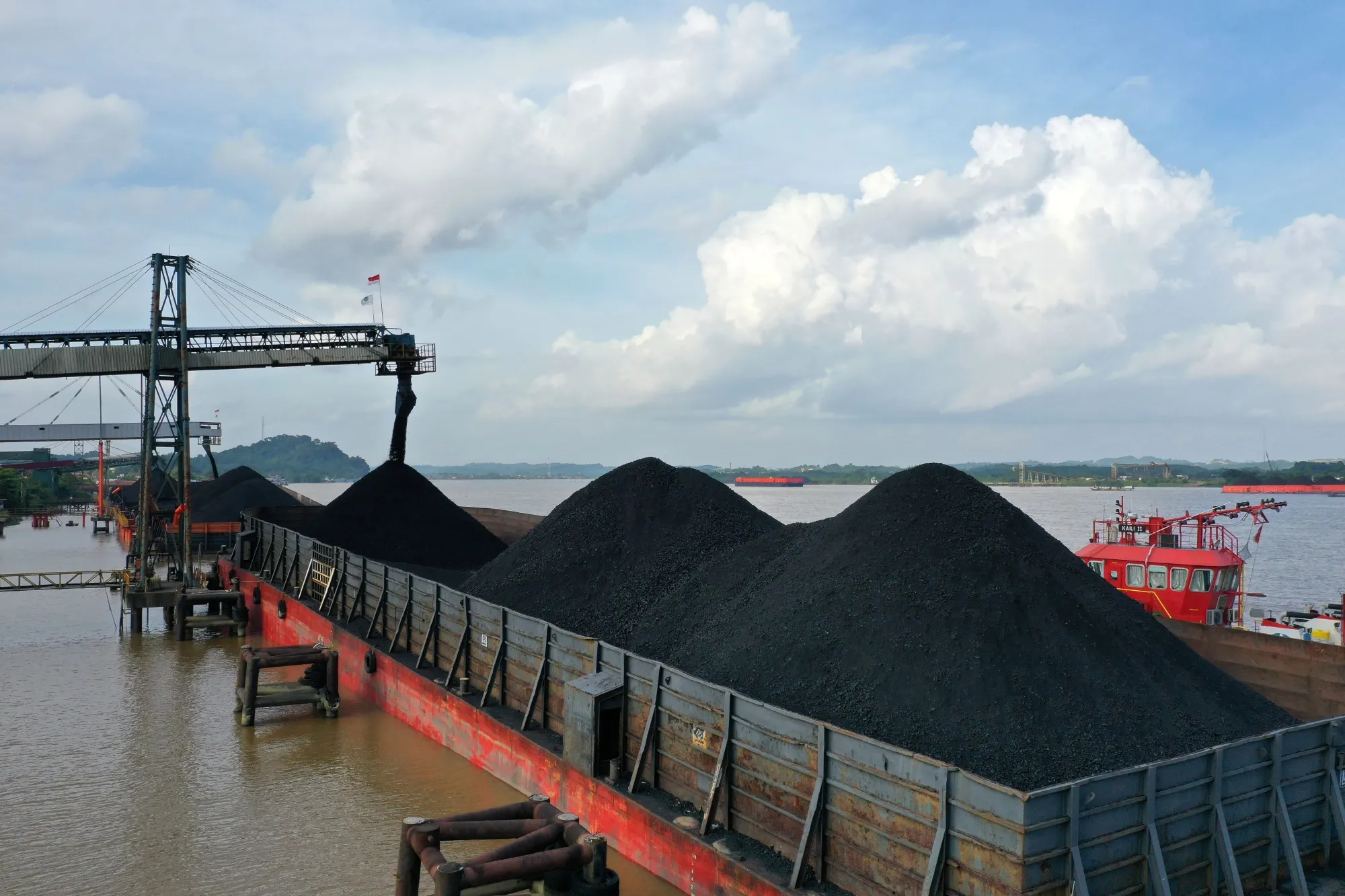 Coal is loaded onto a barge in Kutai Kartanegara, East Kalimantan, Indonesia.