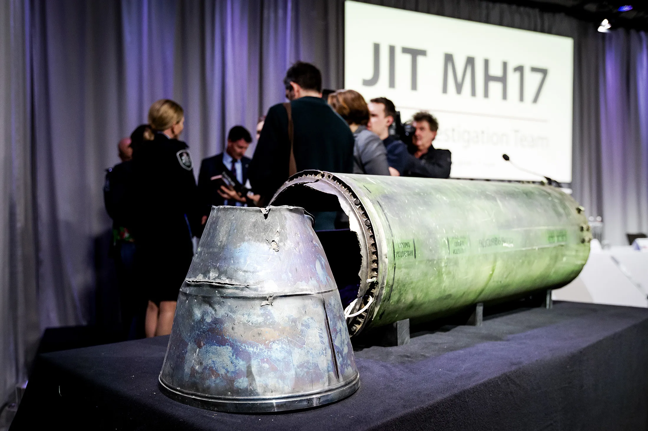 A part of the Buk missle&nbsp;that was fired on the MH17 flight is displayed on a table during a meeting of the Joint Investigation Team&nbsp;in Bunnik on May 24.