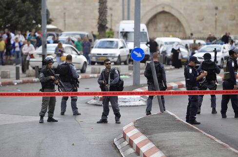 Israeli police stand guard after a Palestinian man was shot dead near the Damascus Gate on Oct. 10
