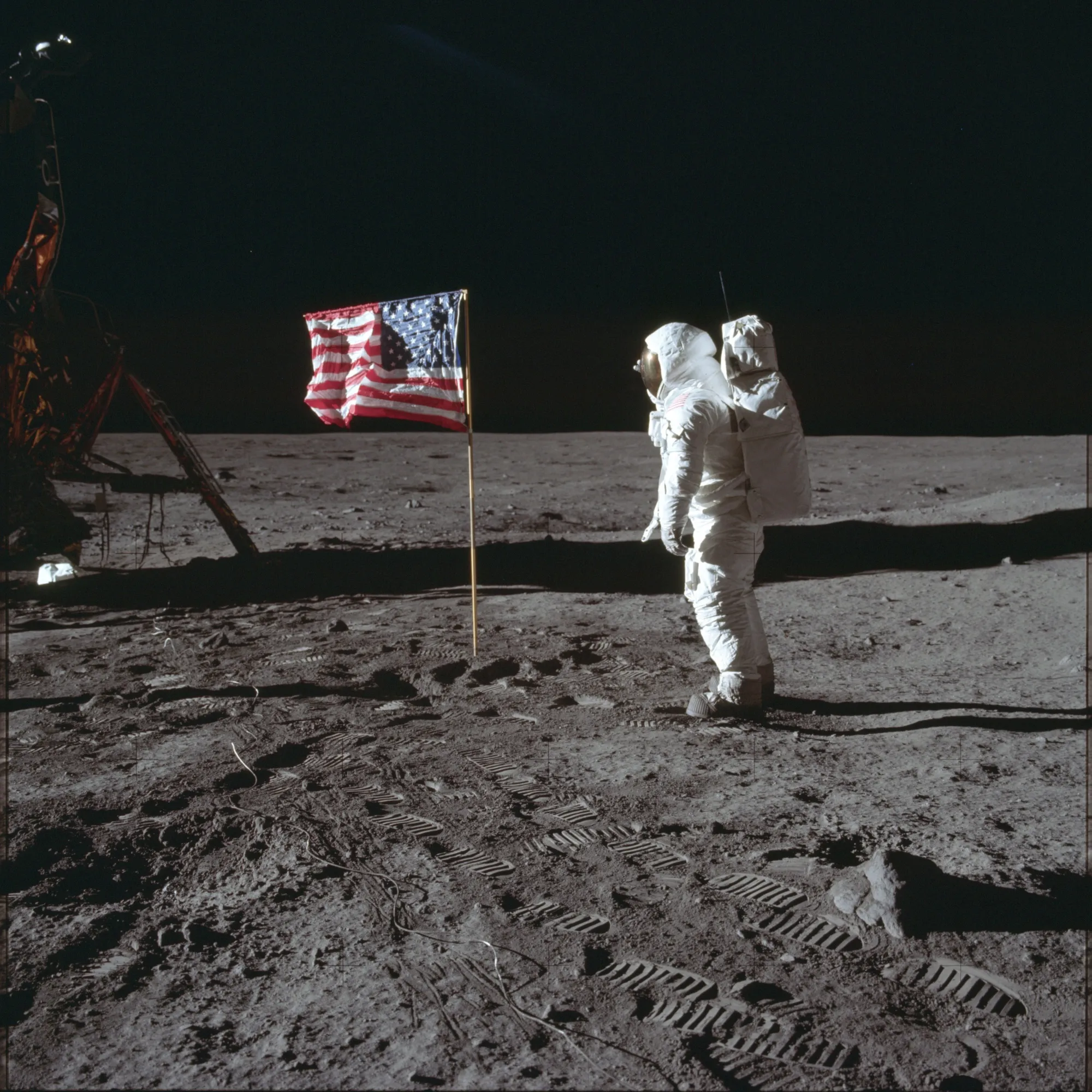 In this July 20, 1969 photo made available by NASA, astronaut Buzz Aldrin Jr. poses for a photograph beside the U.S. flag on the moon during the Apollo 11 mission. Aldrin and fellow astronaut Neil Armstrong were the first men to walk on the lunar surface with temperatures ranging from 243 degrees above to 279 degrees below zero. Astronaut Michael Collins flew the command module. (Neil Armstrong/NASA via AP, File)