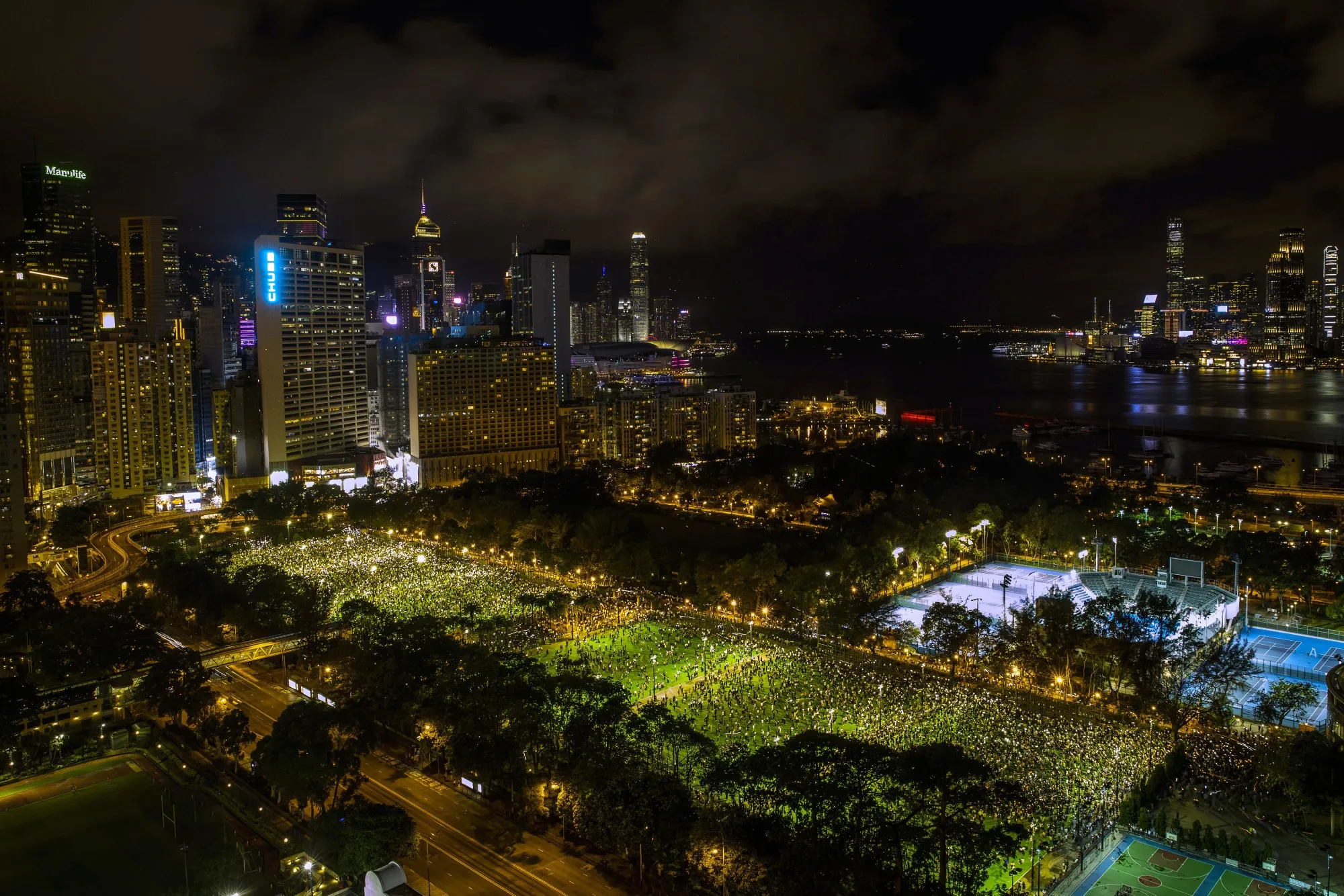 People gather at Victoria Park to commemorate the 31st anniversary of the Tiananmen Square crackdown in Hong Kong on June 4, 2020.