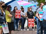 Demonstrators rally at the Alabama State House to draw attention to anti-transgender legislation introduced in Alabama, in Montgomery, on March 30.