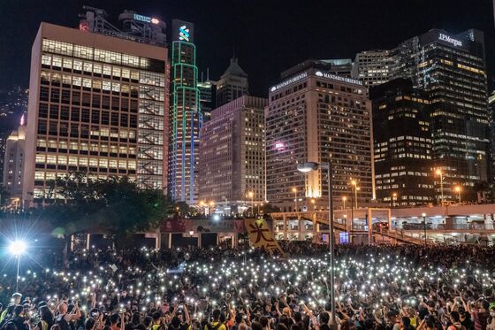 Riot Police Stand By as Demonstrators Gather: Hong Kong Update