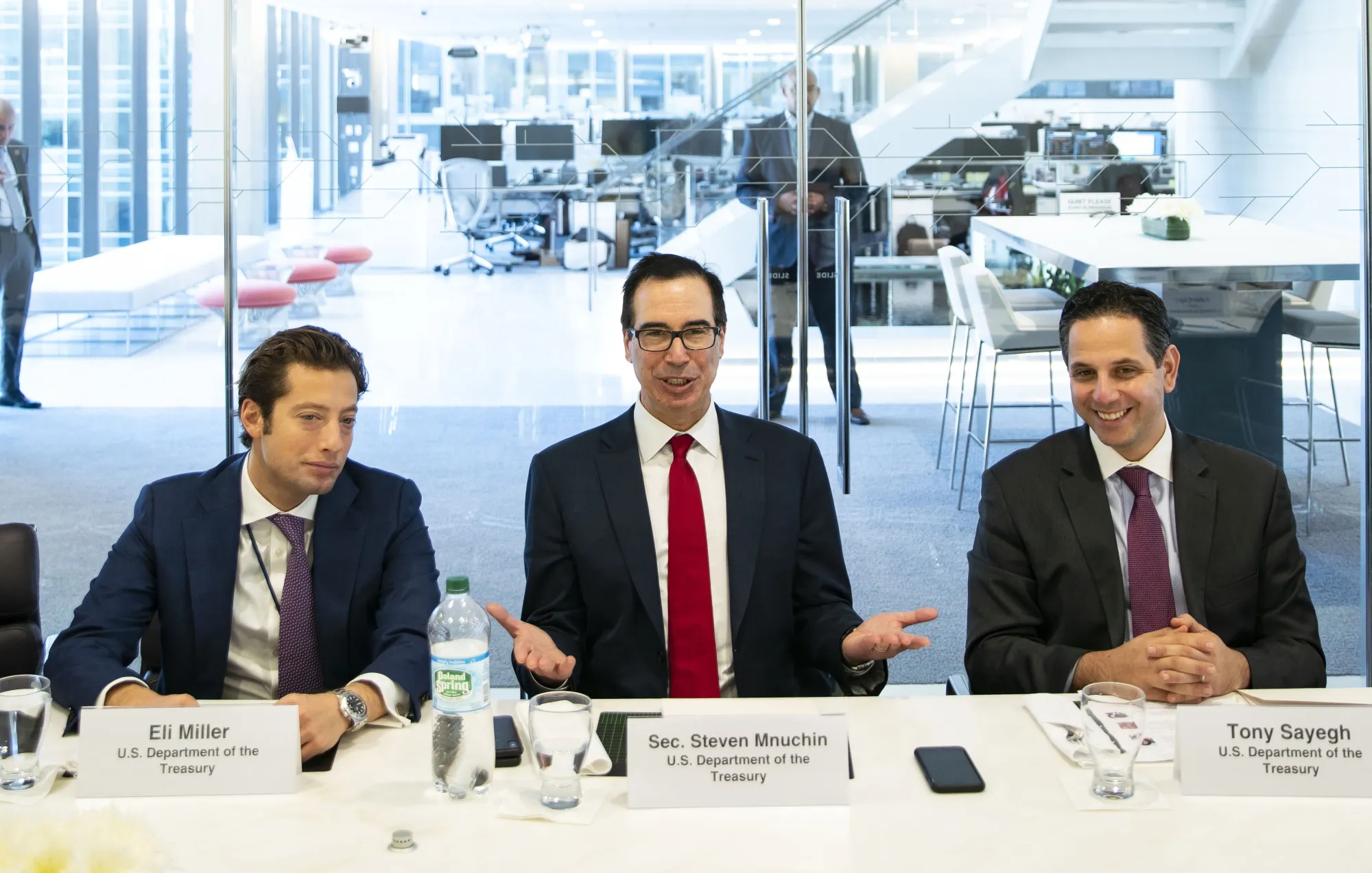Steven Mnuchin, center, and Eli Miller, left.