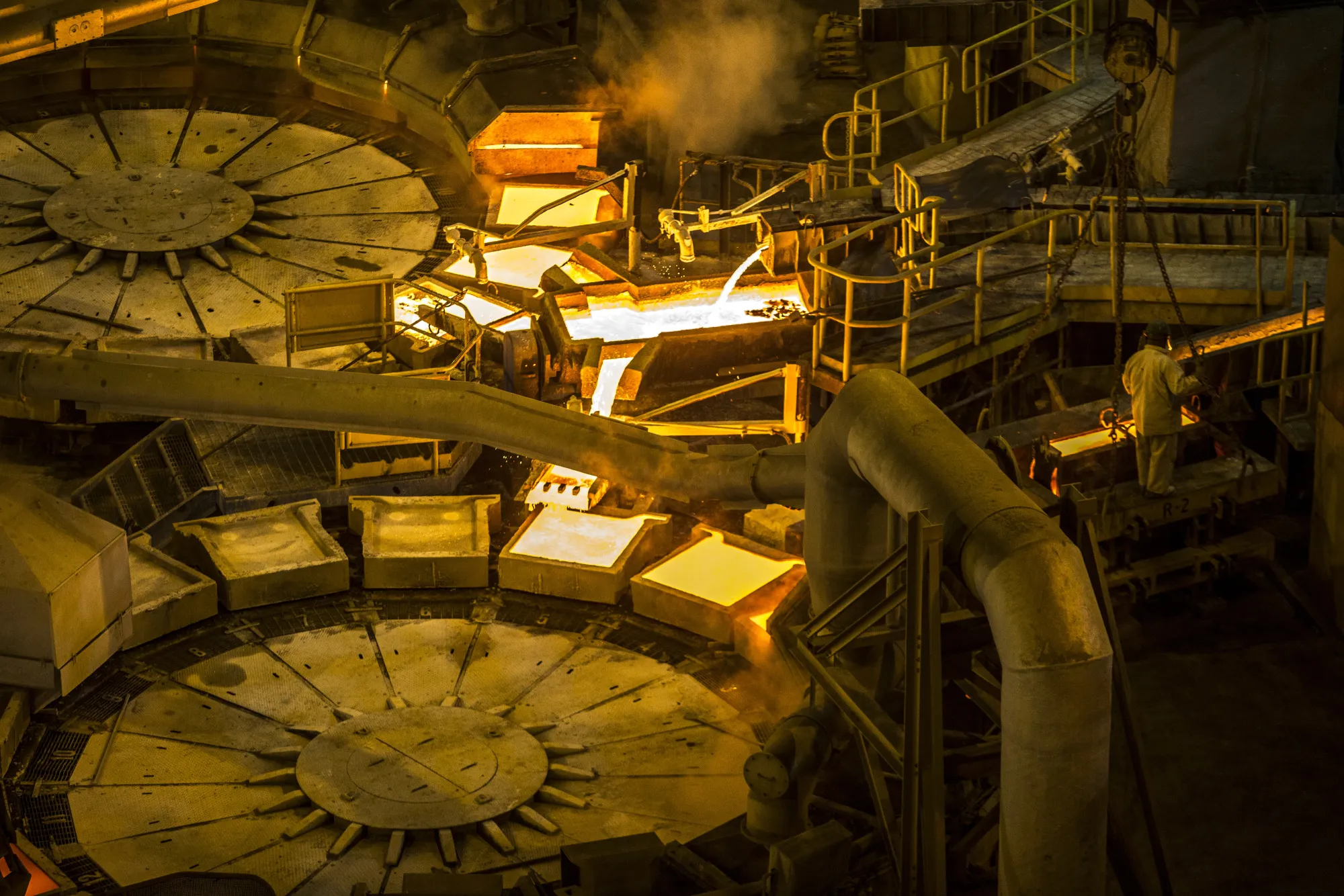 Molten copper pours into ceramic molds to form plates at a Southern Copper Corp. smelter facility in Ilo, Peru.