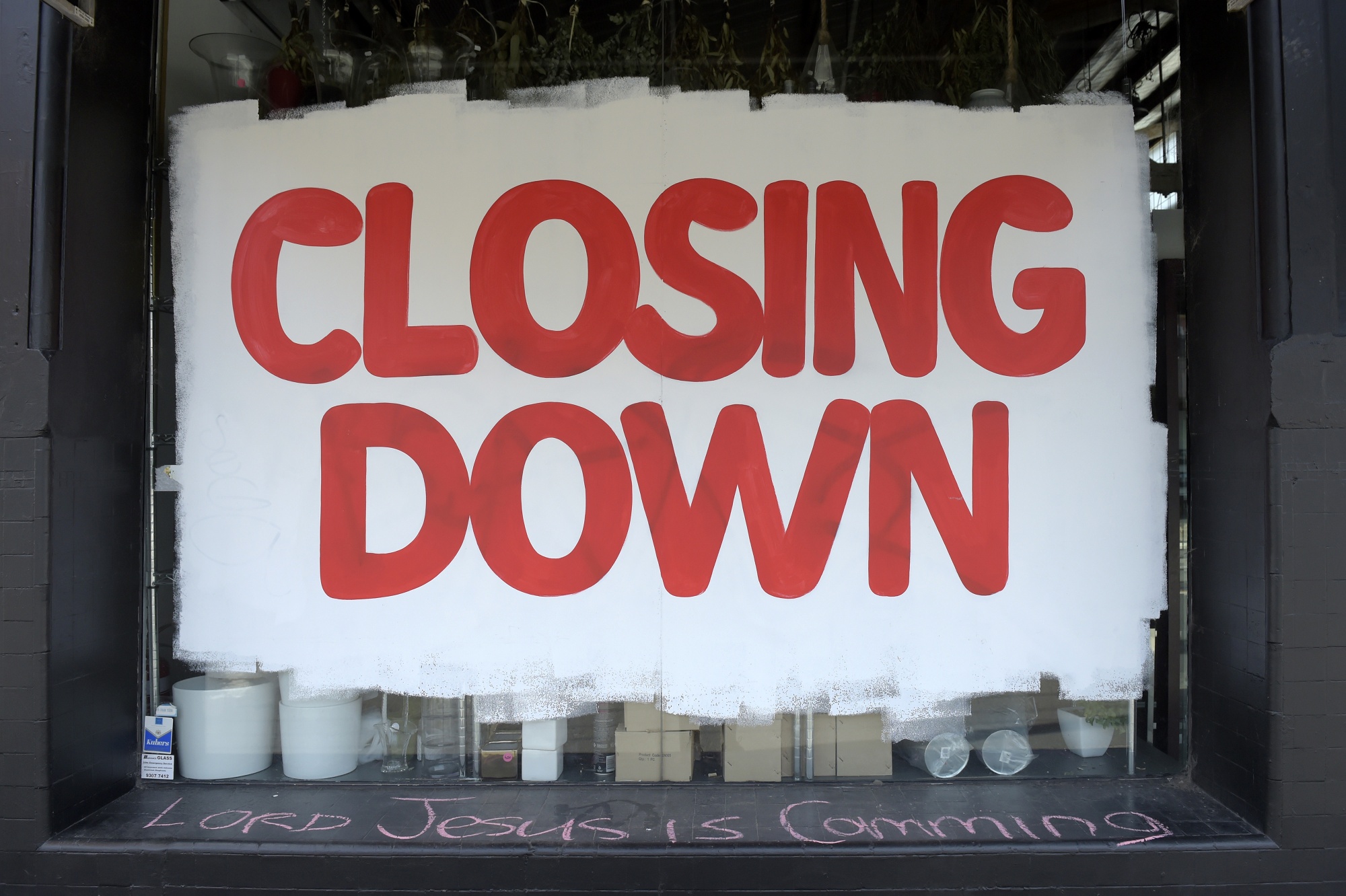 A 'closing down' sign fills the window of a homewares store in Melbourne, Australia, on&nbsp;Sept. 1.