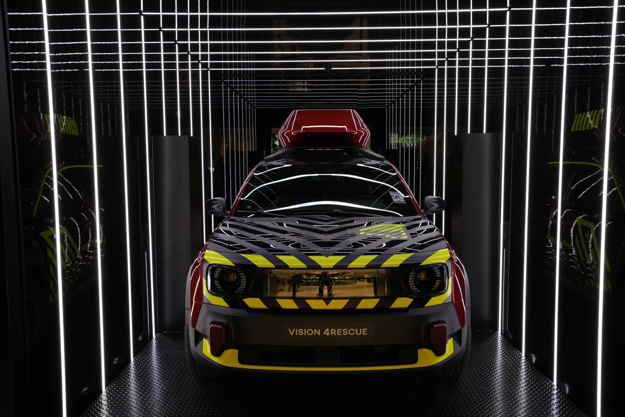 A Renault Vision 4Rescue 4x4 electric vehicle at a showroom in Paris.