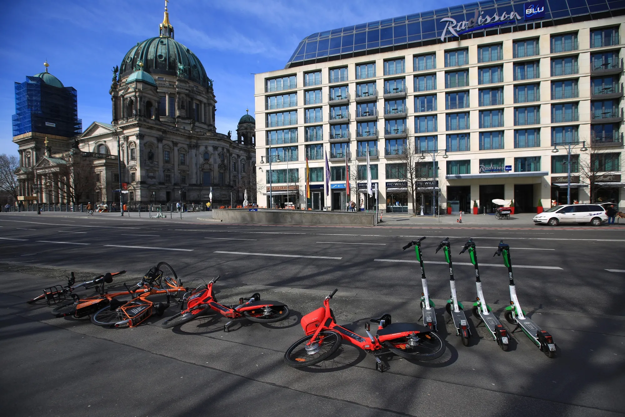 Shared bicycles and electric scooters sit unused in the German capital of Berlin on&nbsp;March 16.&nbsp;