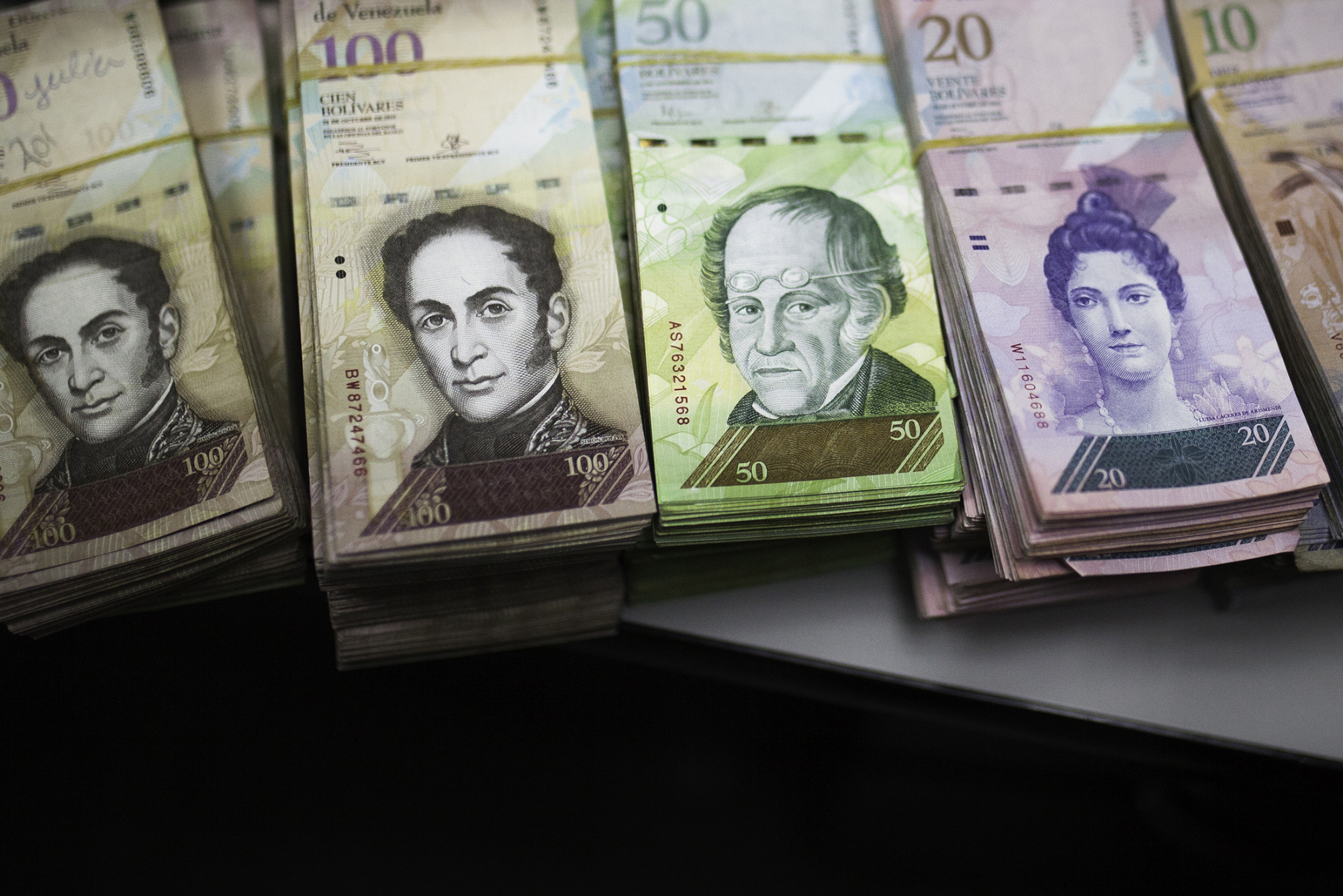 Bolivar notes separated for bank deposit are seen in the office of a bakery in Caracas, Venezuela, on Tuesday, Nov. 29, 2016.&nbsp;