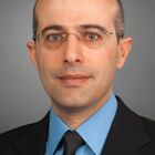 Headshot of Dr Charlie B Kawwas