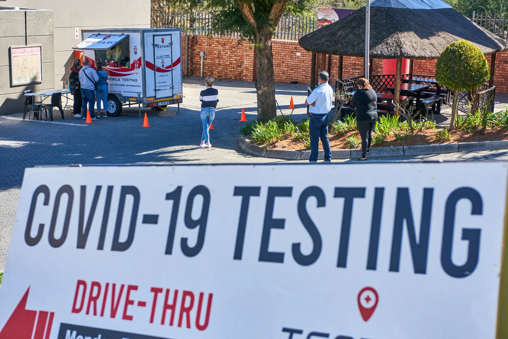Residents queue at a Testaro Covid-19 mobile testing site in the Sandton suburb of Johannesburg.