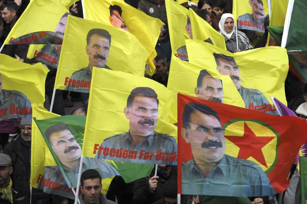 Kurds wave flags with the image of Abdullah Ocalan during a recent protest.