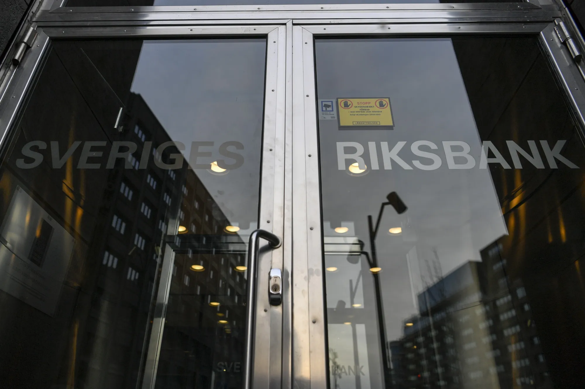 A sign on an entrance reads Sveriges Riksbank at the Swedish central bank headquarters in Stockholm, Sweden.