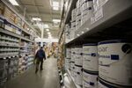 A customer shops for paint at a Lowe's Cos. store in New York, U.S., on Monday, Nov. 19, 2012.&nbsp;